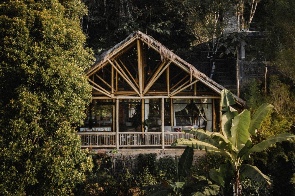 A bamboo villa on the slope at Desa Eko, seen from above